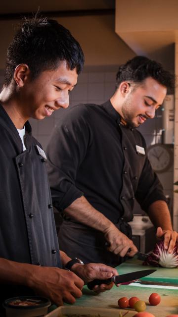 Two chefs working in the kitchen 